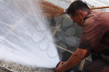 Royalty Free Photo of People Washing Pavement