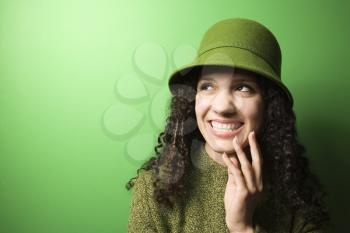 Royalty Free Photo of a Woman Wearing a Green Hat Smiling