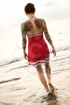 Royalty Free Photo of an  Attractive Tattooed Woman on the Beach in Maui, Hawaii, USA