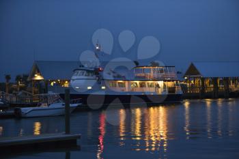 Royalty Free Photo of a Cruise Boat Docked at Night on Bald Head Island, North Carolina