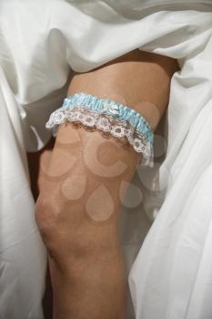 Royalty Free Photo of a Close-up Image of a Bride's Leg Wearing a Garter