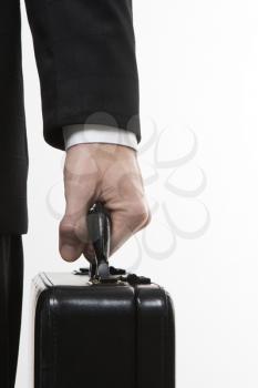 Royalty Free Photo of a Close-up of a Man's Hand Holding a Briefcase