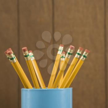 Royalty Free Photo of a Close-Up of a Cup Filled With Wooden Pencils