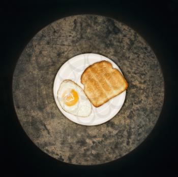 Royalty Free Photo of Toast and a Fried Egg on a Plate