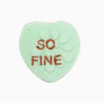 Royalty Free Photo of a Green Candy Heart That Reads So Fine