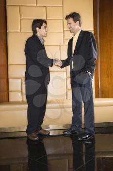 Royalty Free Photo of Two Businessmen Shaking Hands