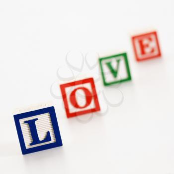 Alphabet toy building blocks spelling the word love.