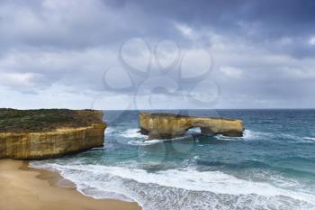 Royalty Free Photo of a Rock Formation in an Arch Shape as Seen from Great Ocean Road in Australia