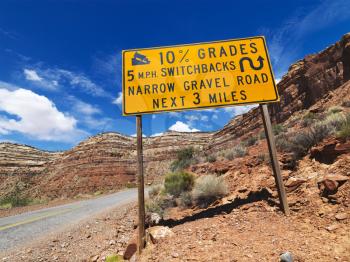 Royalty Free Photo of a Road Sign Warning Steep Grade in Utah Mountainous Area