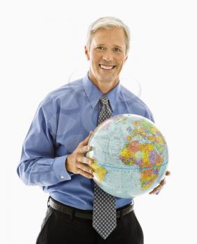 Royalty Free Photo of a Middle-Aged Man Holding a Globe and Smiling