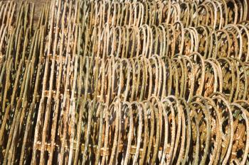 Royalty Free Photo of Metal Fencing Stacked in a Row