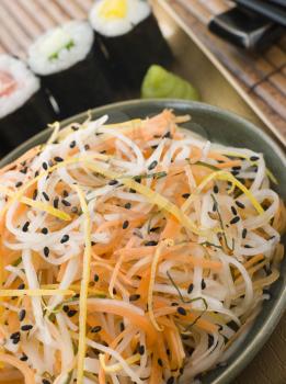 Royalty Free Photo of Daikon and Carrot Salad with Sesame Sushi and Wasabi