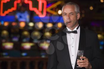 Royalty Free Photo of a Man With a Cigar and Champagne Glass