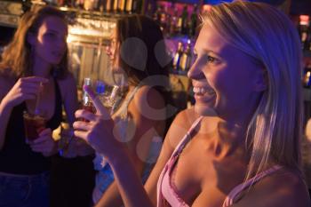 Royalty Free Photo of a Young Woman in a Bar