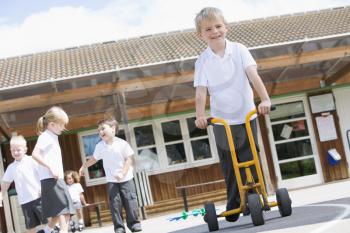 Royalty Free Photo of Children Playing Outside at Recess