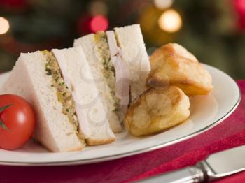 Royalty Free Photo of Roast Turkey Stuffing and Mayonnaise Sandwich with Cold Roast Potatoes