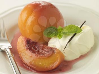 Royalty Free Photo of Peaches Poached in Sauternes With Creme Chantilly