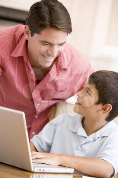 Royalty Free Photo of a Father and Son With a Laptop