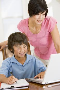 Royalty Free Photo of a Child Getting Help With Homework