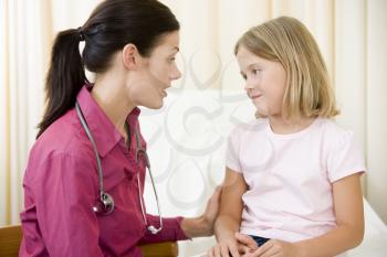 Royalty Free Photo of a Doctor With a Little Girl