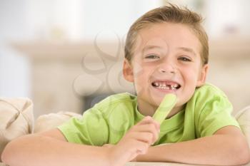 Royalty Free Photo of a Boy Eating Celery