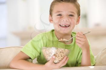 Royalty Free Photo of a Boy Eating Cereal