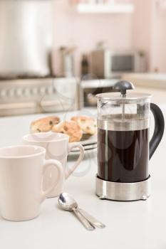 Royalty Free Photo of a Coffee Pot and Scones