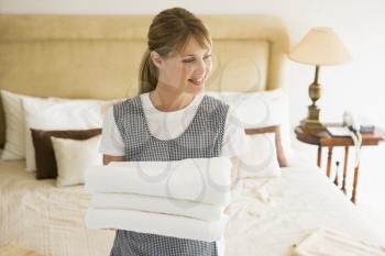 Royalty Free Photo of a Woman Holding Towels