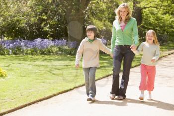 Royalty Free Photo of a Mother and Two Children Walking