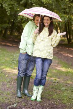 Royalty Free Photo of a Couple in the Rain