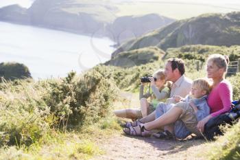 Royalty Free Photo of a Family on a Cliff