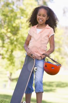 Royalty Free Photo of a Girl With a Skateboard