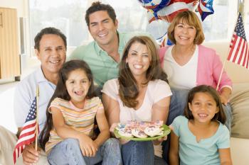 Royalty Free Photo of a Family With Cookies and an American Flag