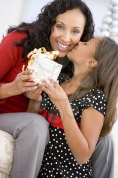 Royalty Free Photo of a Mother and Girl With a Gift