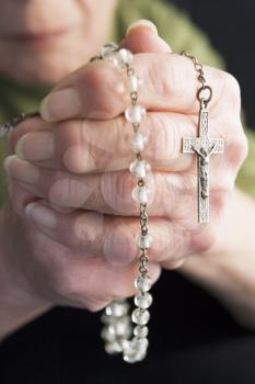 Royalty Free Photo of an Elderly Woman With a Rosary