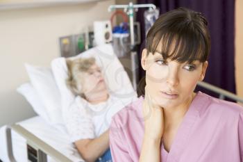 Royalty Free Photo of a Nurse in a Patient's Room