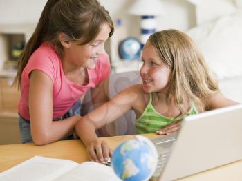 Royalty Free Photo of Two Girls With a Laptop