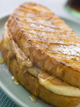 Royalty Free Photo of a Peanut Butter and Banana Eggy Bread Sandwich With Syrup