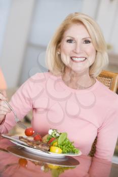 Royalty Free Photo of a Woman Having Dinner