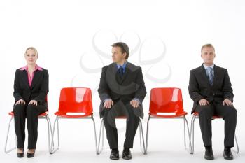 Royalty Free Photo of Three Businesspeople in Chairs