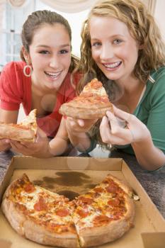 Royalty Free Photo of Girls Eating Pizza