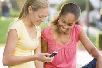 Royalty Free Photo of Girls With a Cellphone