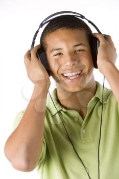 Royalty Free Photo of a Boy Listening to Headphones