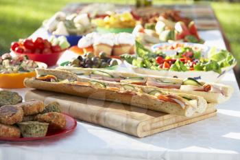 Royalty Free Photo of a Table of Food Outside