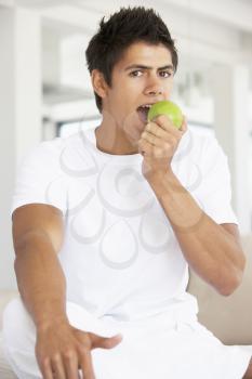 Royalty Free Photo of a Guy Eating an Apple