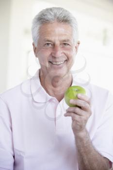 Royalty Free Photo of a Man Eating an Apple
