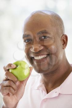 Royalty Free Photo of a Man With an Apple