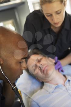 Royalty Free Photo of Paramedics With a Patient