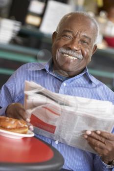 Royalty Free Photo of a Man With the Morning Paper