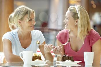 Royalty Free Photo of Two Women Having Lunch at a Mall